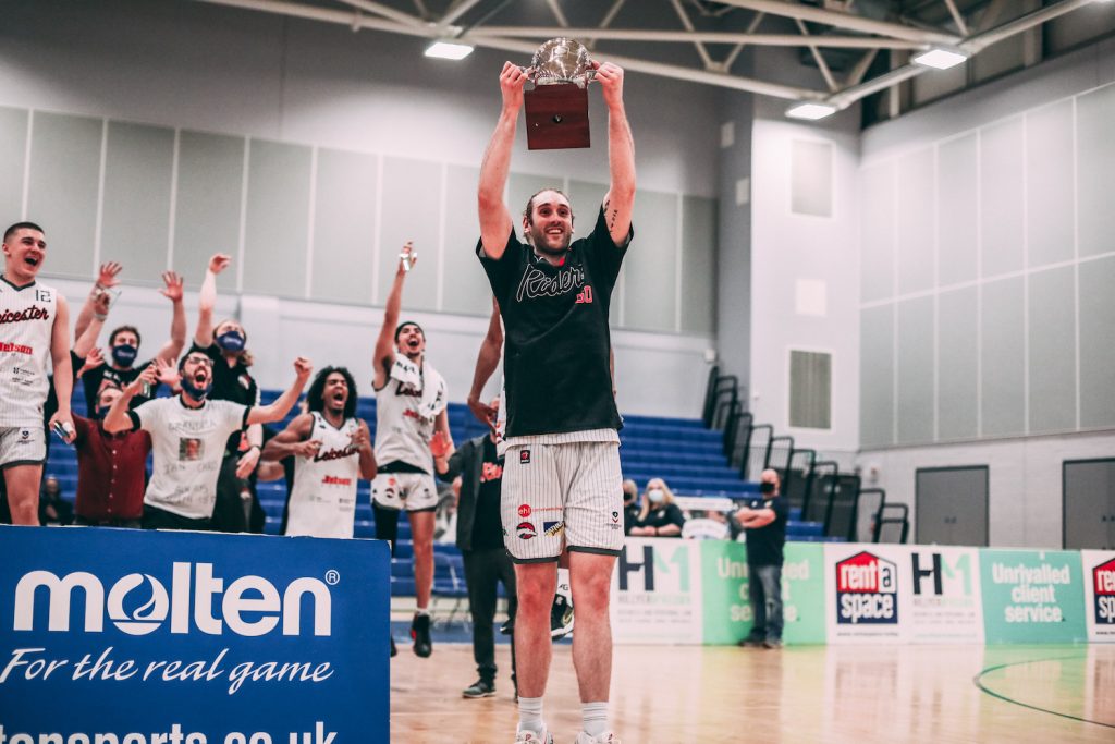 Darien Nelson-Henry lifting the 2020/21 BBL Championship trophy